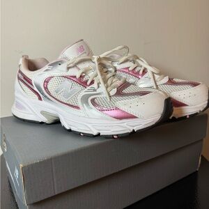 New Balance 530 athletic shoes in the White/Pink Sugar colorway. Unisex size 7